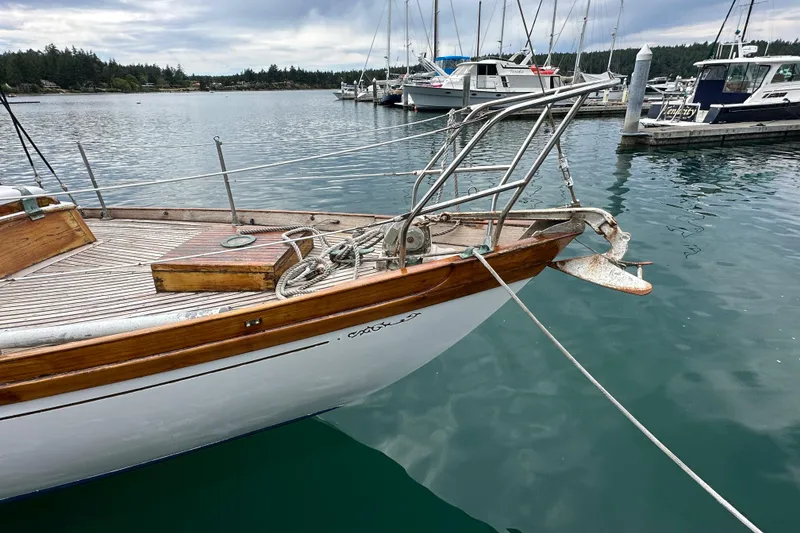 Slide: The Image of 1964 Cheoy Lee Lion Class Sloop docked in a marina. - 3