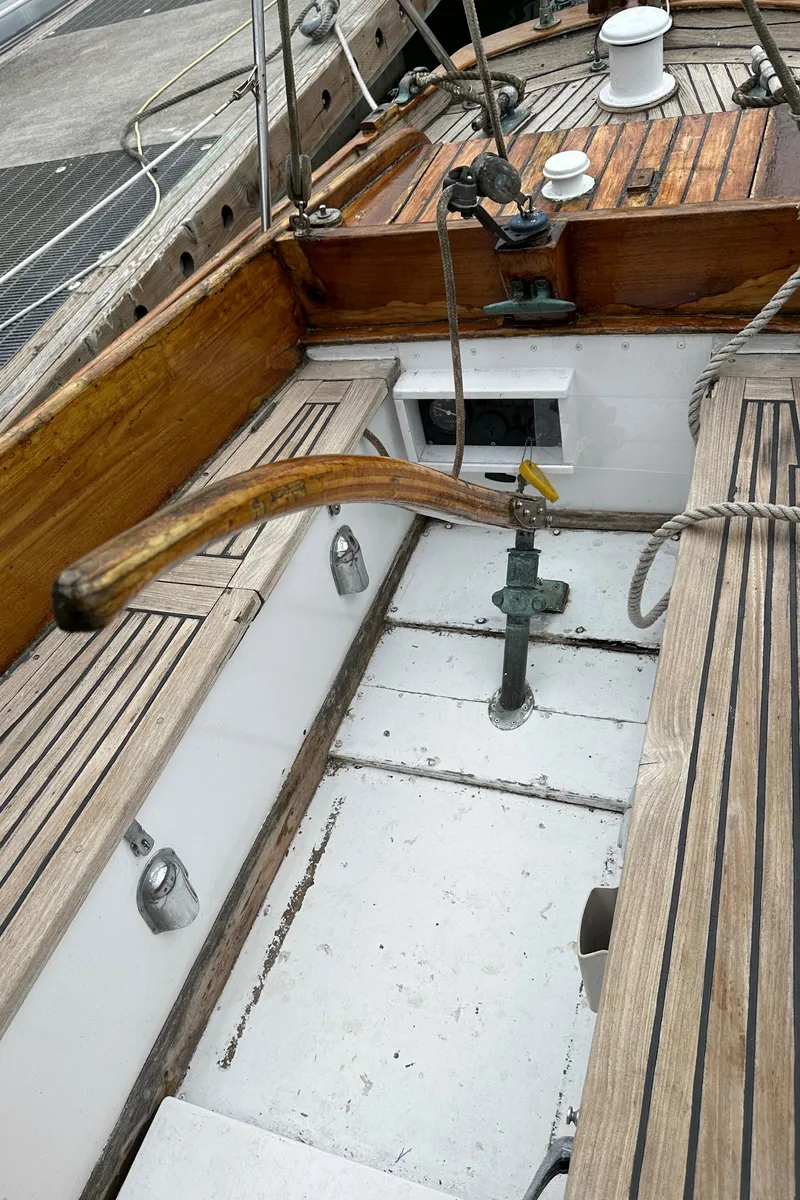 Slide: The Image of 1964 Cheoy Lee Lion Class Sloop cockpit with wooden tiller and deck. - 8