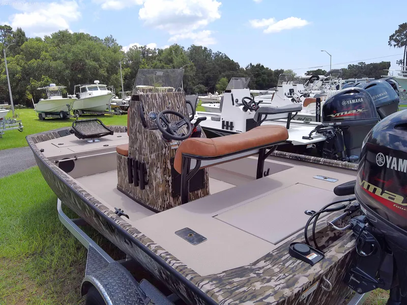 Slide: The Image of 2023 Avid 18 Rogue boat with Yamaha outboard motor in a boatyard. - 4