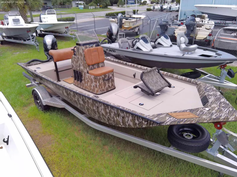 Slide: The Image of 2023 Avid 18 Rogue boat with camouflage design on a trailer. - 5