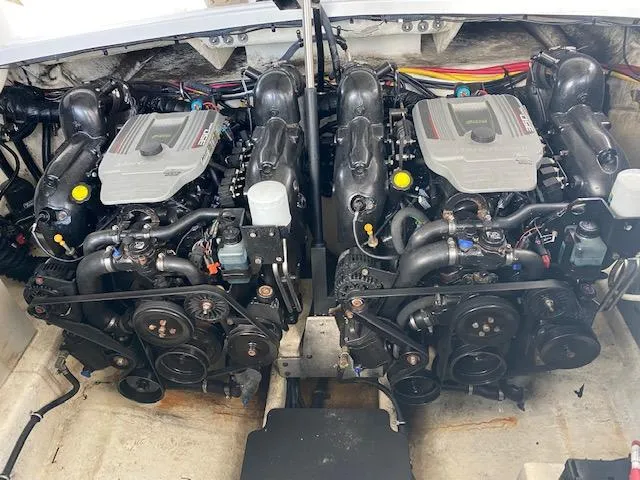 Slide: The Image of 2015 Monterey 328 Super Sport boat interior with seating, table, and control panel. - 11