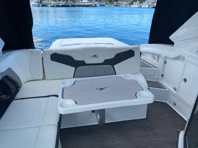 Slide: The Image of Dashboard of a 2015 Monterey 328 Super Sport boat with navigation system and gauges. - 12