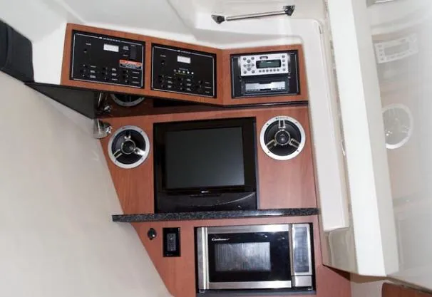 Slide: The Image of Interior cabin of 2015 Monterey 328 Super Sport with life jackets and storage. - 13