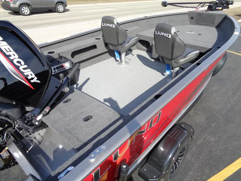 Slide: The Image of 2023 Lund 1775 Pro Guide fishing boat with Mercury engine, two seats, and spacious deck. - 10