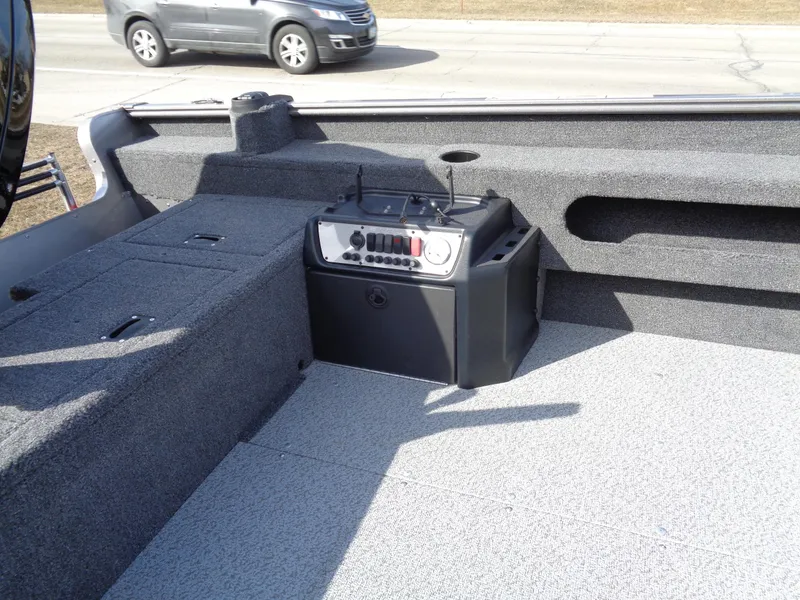 Slide: The Image of 2023 Lund 1775 Pro Guide boat interior with control panel. - 13