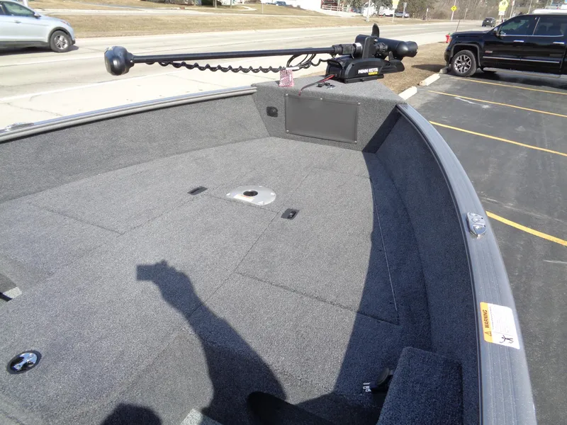 Slide: The Image of 2023 Lund 1775 Pro Guide boat interior with trolling motor. - 14