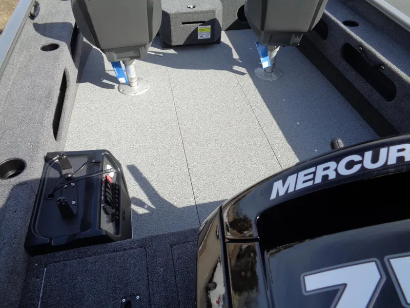 Slide: The Image of 2023 Lund 1775 Pro Guide boat interior with Mercury engine and seating. - 15