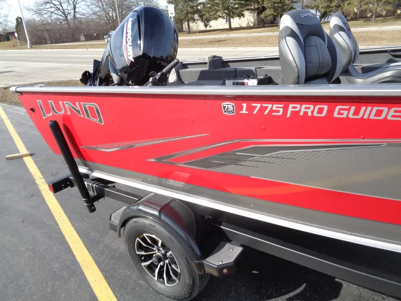 Slide: The Image of 2023 Lund 1775 Pro Guide fishing boat with Honda outboard motor. - 5