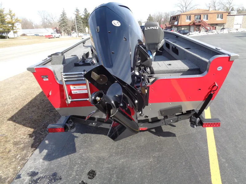 Slide: The Image of 2023 Lund 1775 Pro Guide boat with outboard motor, rear view. - 9