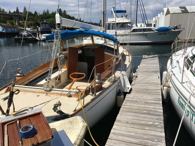 Slide: The Image of Vintage 1958 Custom 38' Sloop docked at marina, surrounded by other boats. - 5