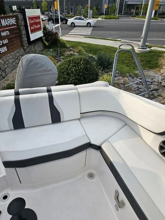 Slide: The Image of 2017 Regal 23 OBX boat interior with white and black seating. - 1