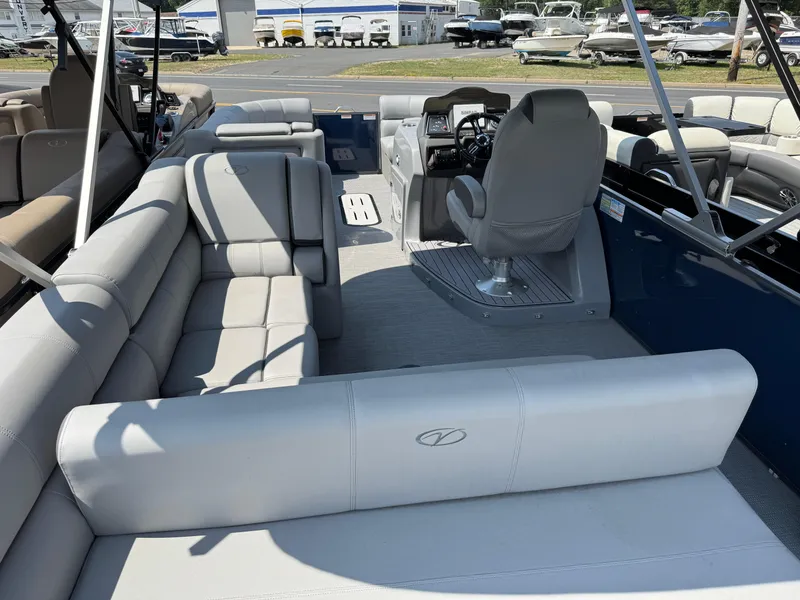 Slide: The Image of 2023 Veranda VTX 25 VLB pontoon boat interior with plush seating and captain's chair. - 15