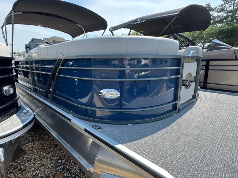 Slide: The Image of 2023 Veranda VTX 25 VLB pontoon boat with blue exterior and canopy. - 4