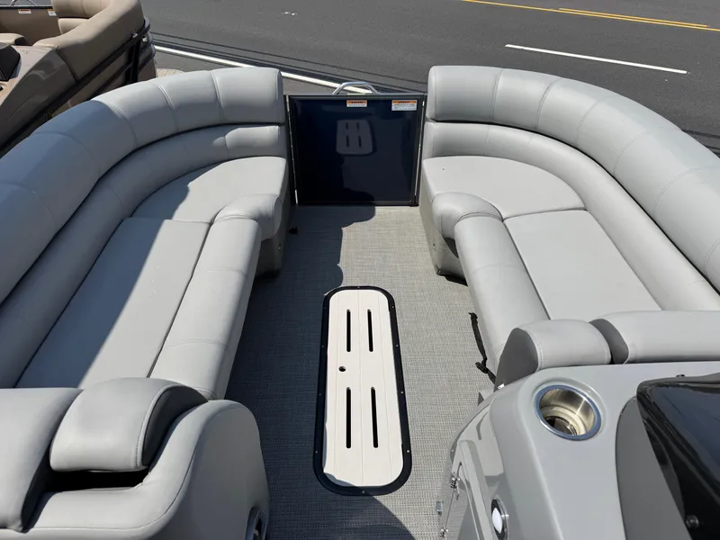 Slide: The Image of 2023 Veranda VTX 25 VLB pontoon boat interior with plush seating and modern design. - 7