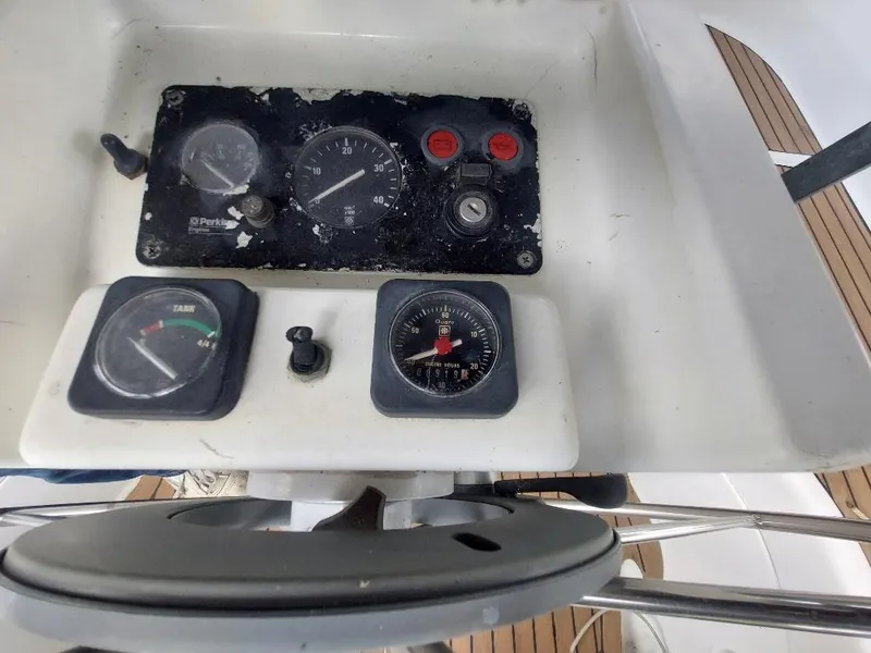 Slide: The Image of Control panel of a 1995 Beneteau Oceanis 351 sailboat with gauges and compass. - 13
