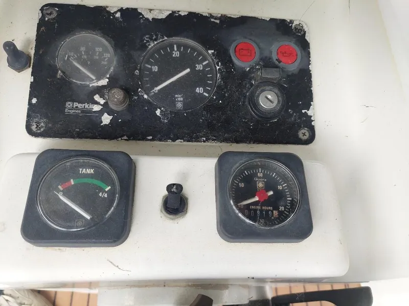 Slide: The Image of Control panel of a 1995 Beneteau Oceanis 351 sailboat with gauges and switches. - 14