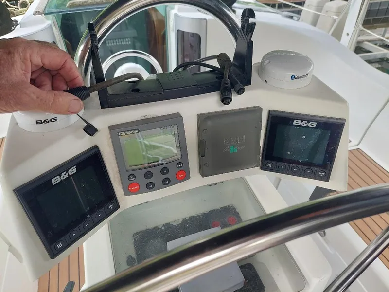 Slide: The Image of Steering console of 1995 Beneteau Oceanis 351 sailboat with navigation instruments. - 16