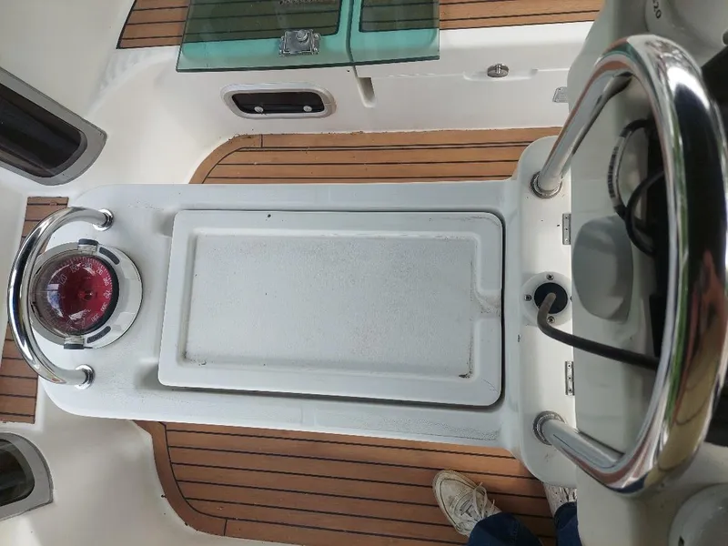 Slide: The Image of Cockpit view of 1995 Beneteau Oceanis 351 sailboat with teak flooring and steering wheel. - 19