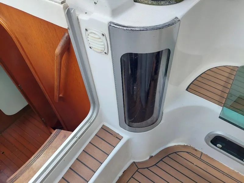 Slide: The Image of 1995 Beneteau Oceanis 351 yacht interior with wood and white accents. - 21