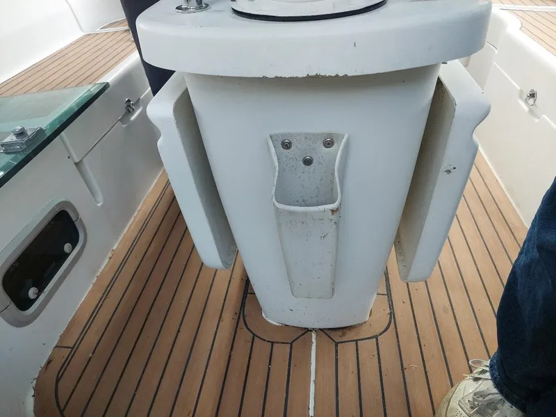 Slide: The Image of Cockpit of 1995 Beneteau Oceanis 351 sailboat with teak flooring and pedestal. - 22
