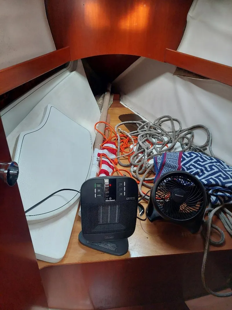 Slide: The Image of Interior of 1995 Beneteau Oceanis 351 sailboat with ropes, fan, and heater. - 38