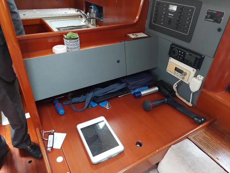 Slide: The Image of Interior of 1995 Beneteau Oceanis 351 sailboat with navigation equipment and accessories. - 45