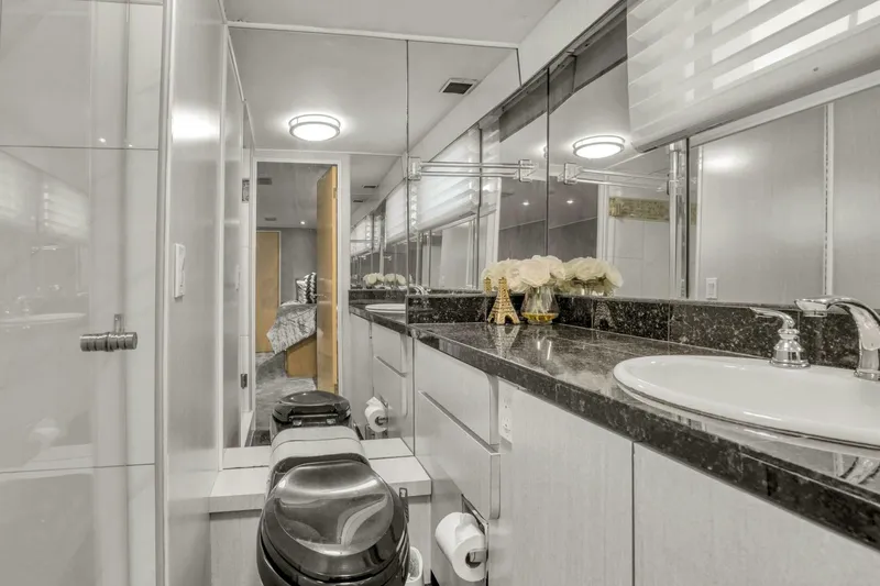 Slide: The Image of Luxurious bathroom in 1983 Broward 108 Cockpit Motor Yacht with modern fixtures and elegant design. - 20
