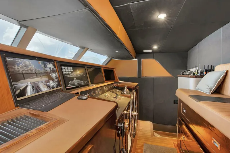 Slide: The Image of Cockpit of 1983 Broward 108 Cockpit Motor Yacht with modern navigation equipment. - 31