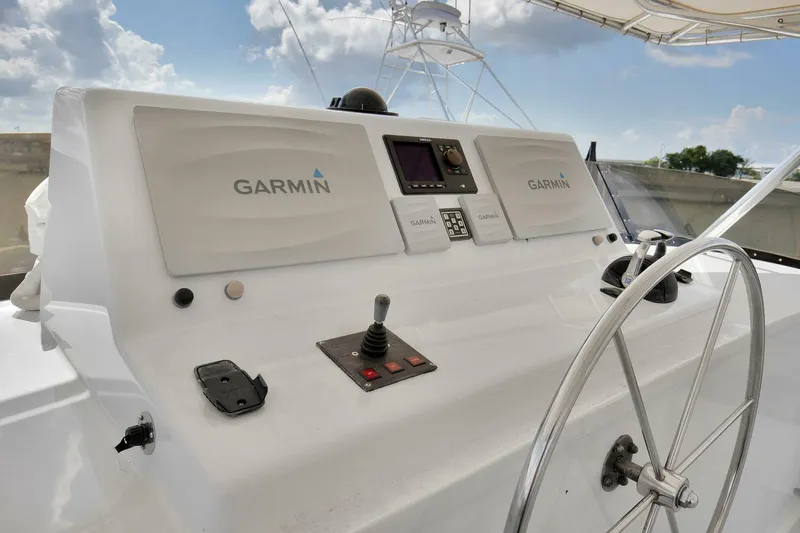 Slide: The Image of Cockpit of 1983 Broward 108 Cockpit Motor Yacht with Garmin navigation system. - 41