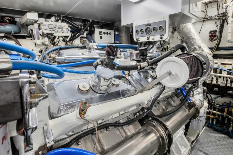 Slide: The Image of Engine room of a 1983 Broward 108 Cockpit Motor Yacht with detailed machinery. - 46