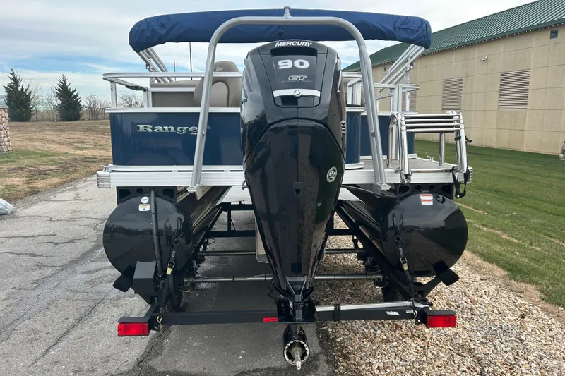 Slide: The Image of 2024 Ranger Reata 200F pontoon boat on trailer, side view. - 1