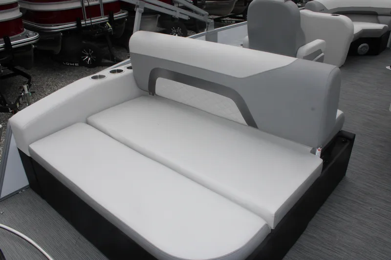 Slide: The Image of 2023 Lowe SS210 Super Sport boat interior with gray and white seating. - 4