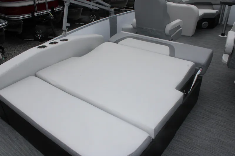 Slide: The Image of 2023 Lowe SS210 Super Sport boat interior with spacious seating and cup holders. - 5