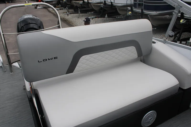 Slide: The Image of 2023 Lowe SS210 Super Sport boat with cushioned seating and modern design. - 6