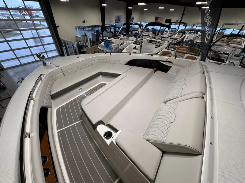 Slide: The Image of 2023 Sea Ray Sundancer 370 OB interior with luxurious seating in a showroom. - 13