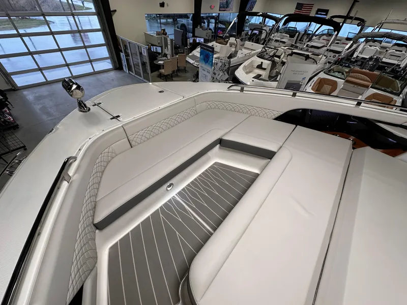 Slide: The Image of 2023 Sea Ray Sundancer 370 OB interior with luxurious seating in a showroom. - 15