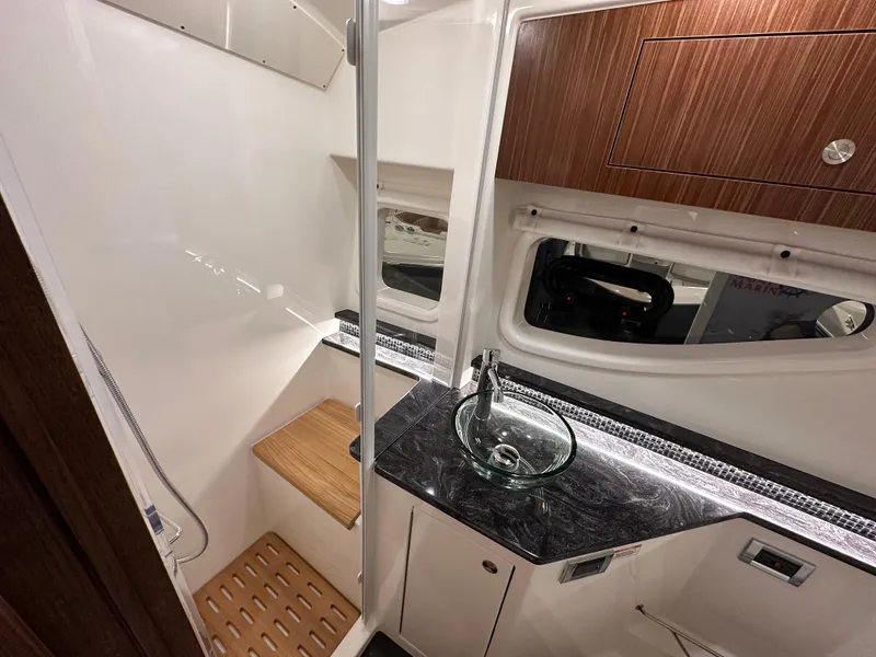 Slide: The Image of Luxurious bathroom interior of 2023 Sea Ray Sundancer 370 OB yacht with modern fixtures. - 23