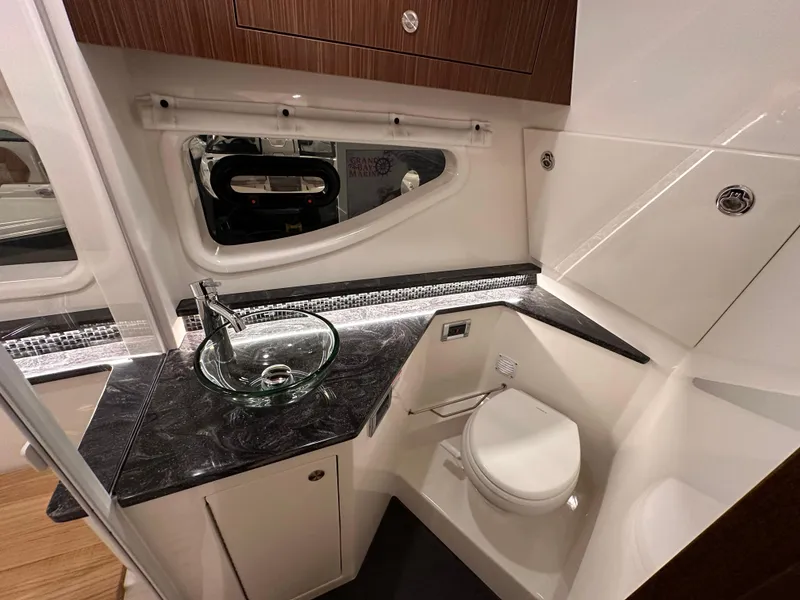 Slide: The Image of Luxurious bathroom in 2023 Sea Ray Sundancer 370 OB yacht with modern fixtures and elegant design. - 24
