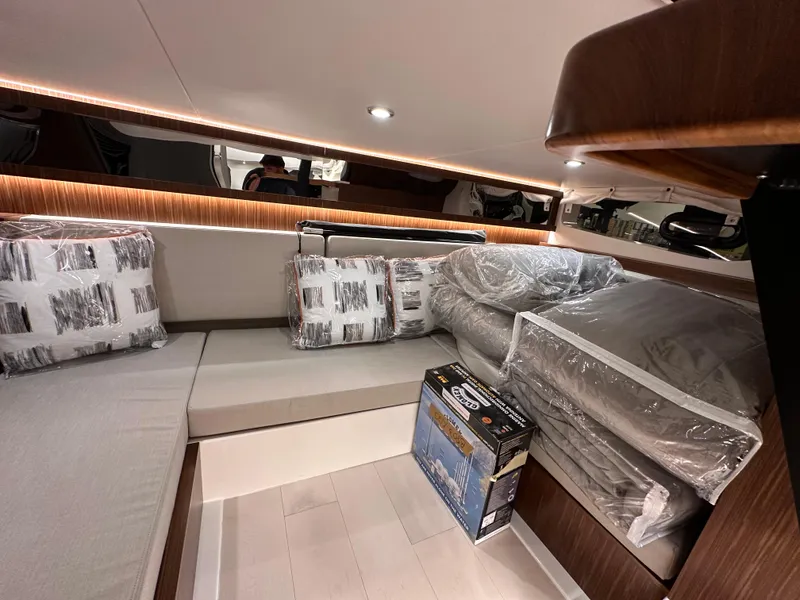 Slide: The Image of Interior of 2023 Sea Ray Sundancer 370 OB with modern seating and decor. - 27