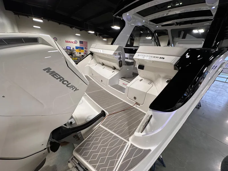 Slide: The Image of 2023 Sea Ray Sundancer 370 OB with Mercury engine, sleek design, and modern interior. - 31