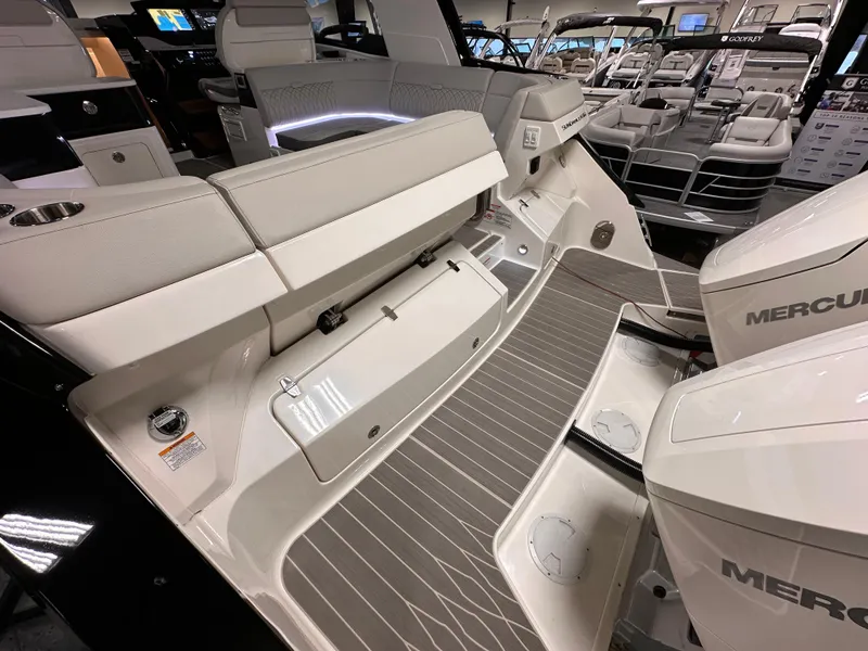 Slide: The Image of 2023 Sea Ray Sundancer 370 OB boat interior with Mercury engines, showcasing luxury seating and design. - 34