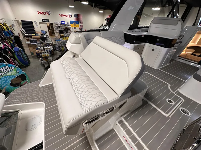 Slide: The Image of 2023 Sea Ray Sundancer 370 OB interior with plush seating and modern design in showroom. - 37