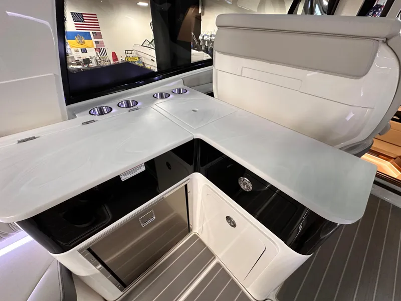 Slide: The Image of 2023 Sea Ray Sundancer 370 OB interior with sleek kitchenette and modern design. - 39