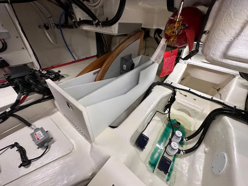 Slide: The Image of Engine compartment of 2023 Sea Ray Sundancer 370 OB with visible wiring and components. - 45