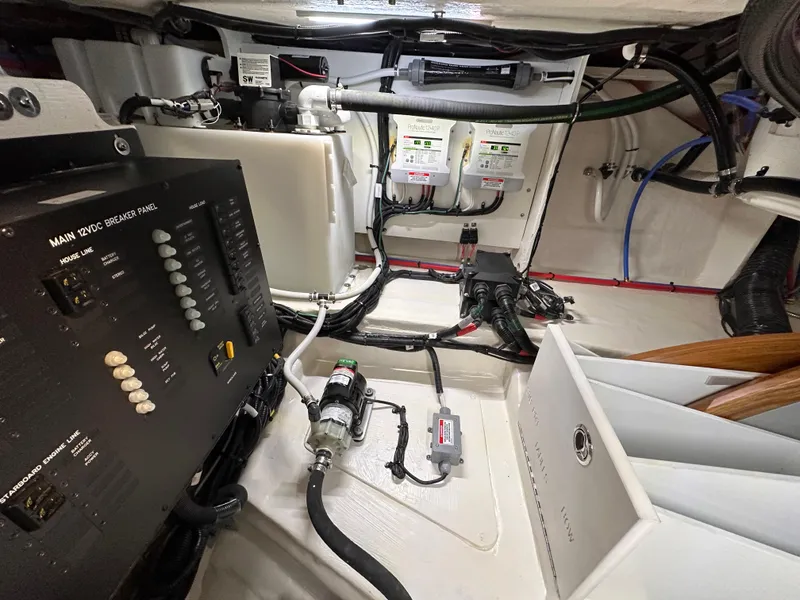 Slide: The Image of Engine room of 2023 Sea Ray Sundancer 370 OB with electrical panel and wiring. - 46