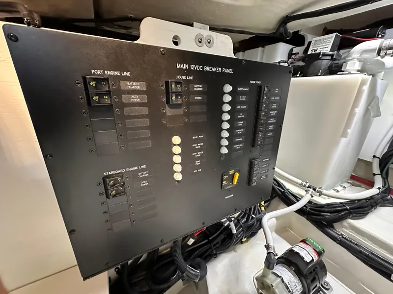 Slide: The Image of 2023 Sea Ray Sundancer 370 OB electrical panel in engine room. - 47