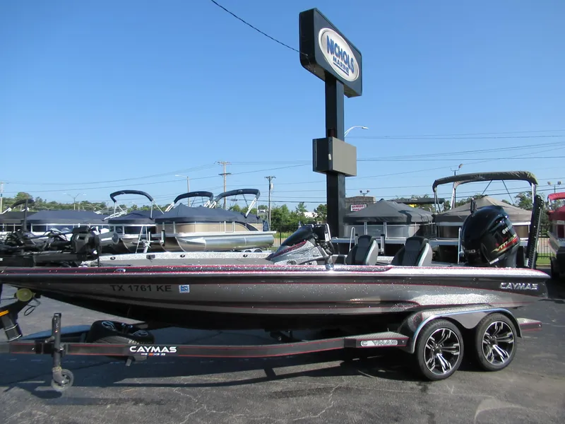Slide: The Image of 2021 Caymas CX21 Pro boat on a trailer at a dealership. - 0