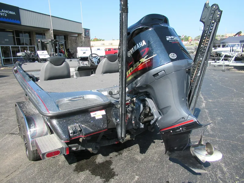 Slide: The Image of 2021 Caymas CX21 Pro boat with Yamaha 250 motor, rear view in dealership lot. - 4