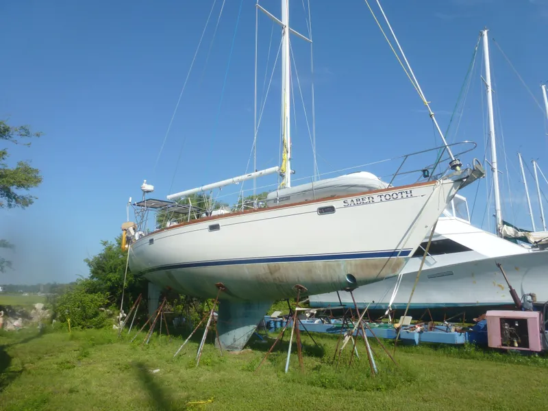 The Image of 1990 Sabre 425 sailboat on stands for maintenance. - 1