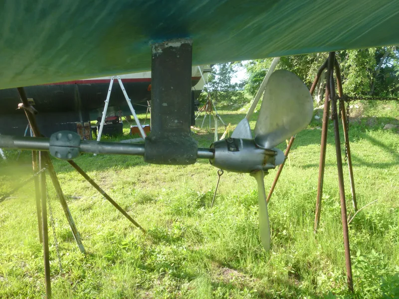 Slide: The Image of Propeller and shaft of a 1990 Sabre 425 sailboat on a grassy yard. - 12